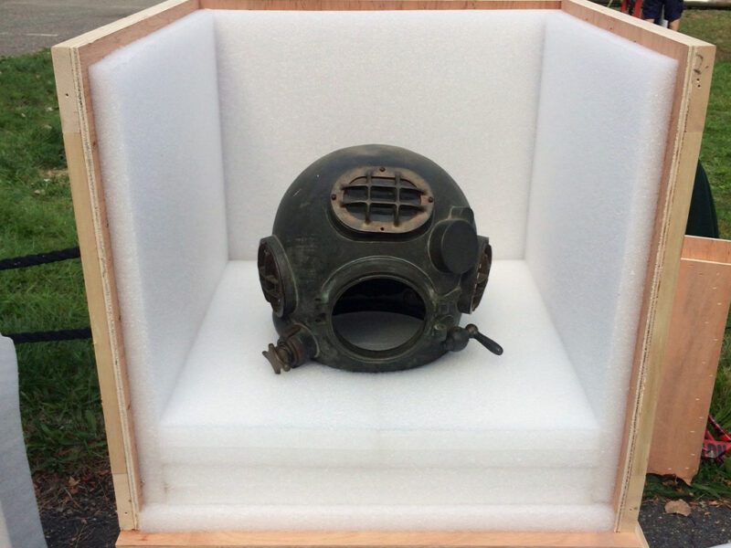 Diver helmet surrounded in foam and wood for museum artifact packing service