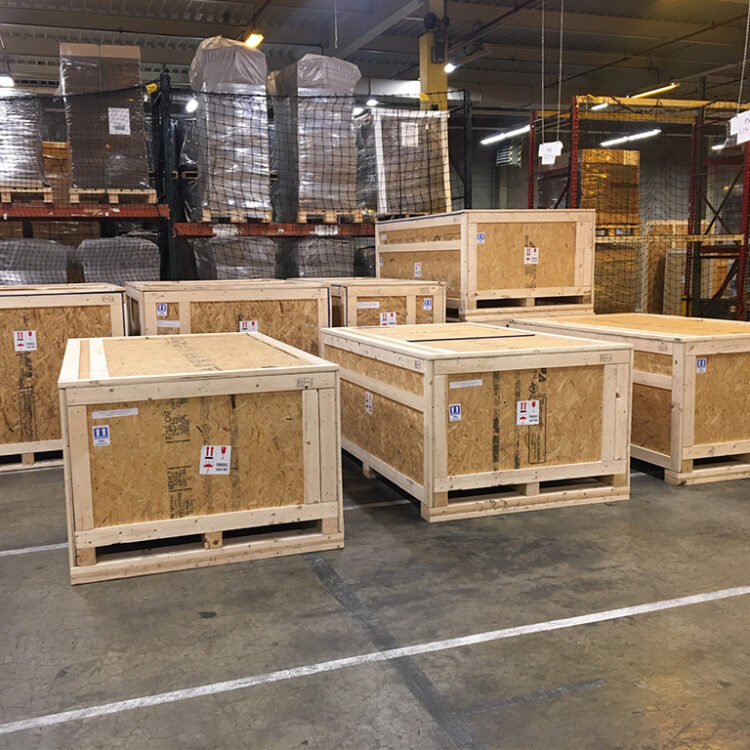 Front view of plant relocation crates containing guillotine cutting systems