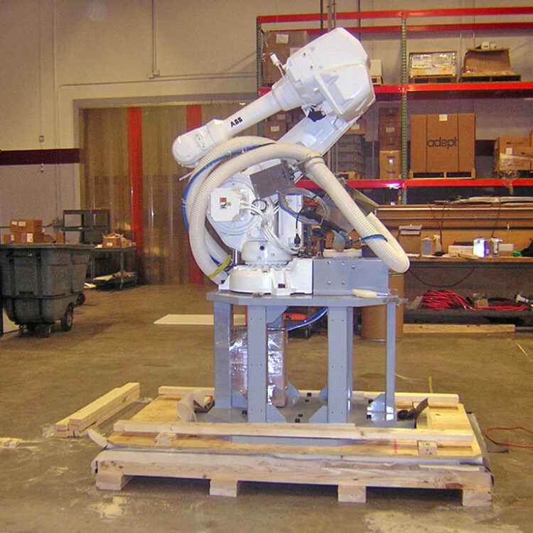 Open machinery crating on pallet for the automated robotic cosmetics-packaging assembly line