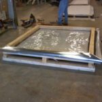 Stabilized humidity-controlled mylar bags encasing wooden pallet for machinery crating
