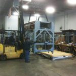 Automated assembly system crates handled safely by forklift
