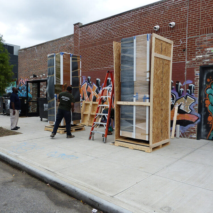 Pre-built crates holding large scale display, fabricated to exact specifications and constructed with a unique shock mount crate base design intended to protect the columns from the rigors of transport