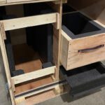 custom wood drawers lined with foam inside of a wood crate